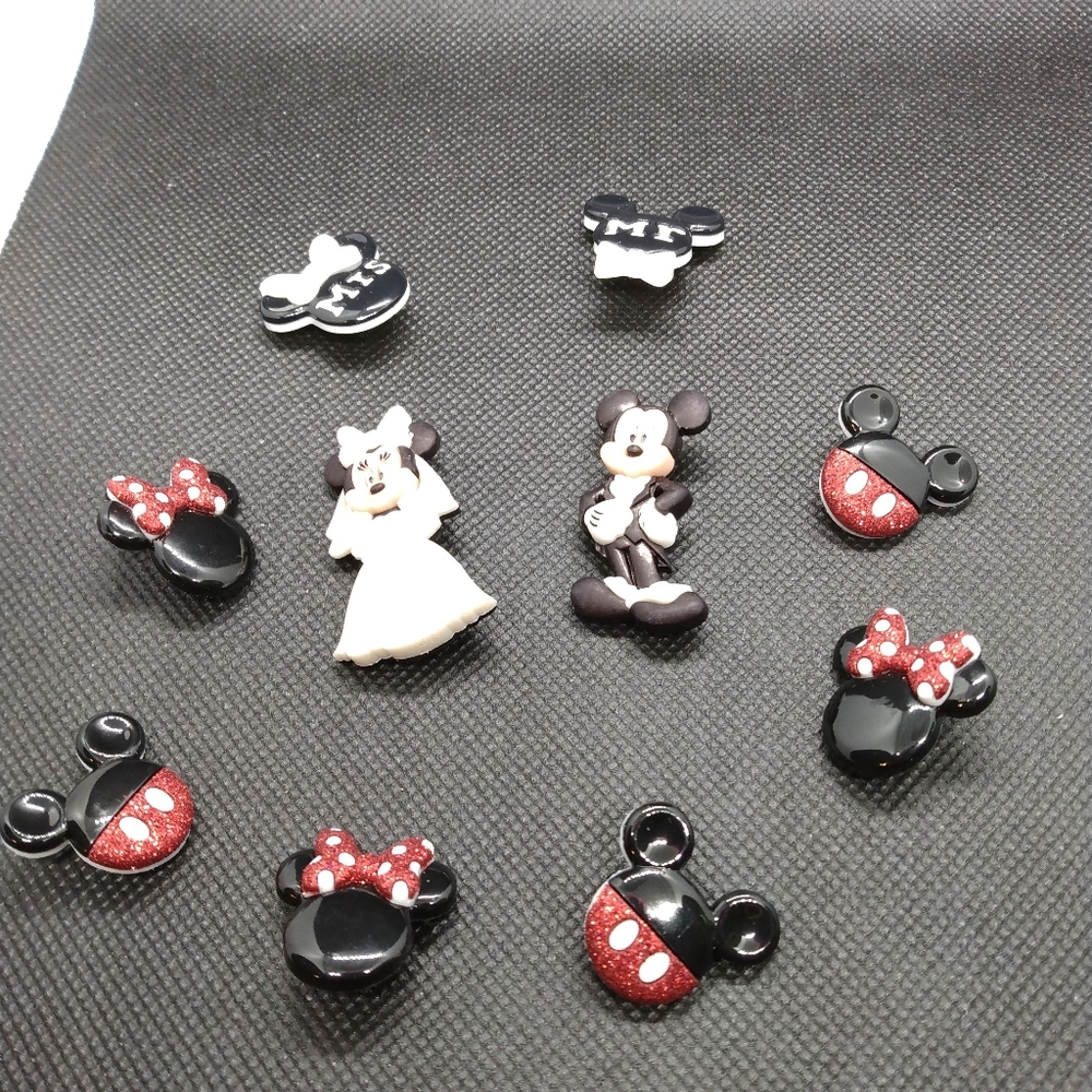 Mickey and Minnie croc buttons. Like new.